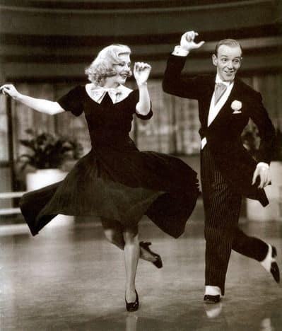 A couple dancing to rock and roll music,