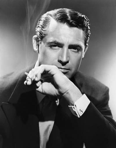 Cary Grant smoking cigar portrait.