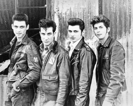 Four men embracing the greaser style.